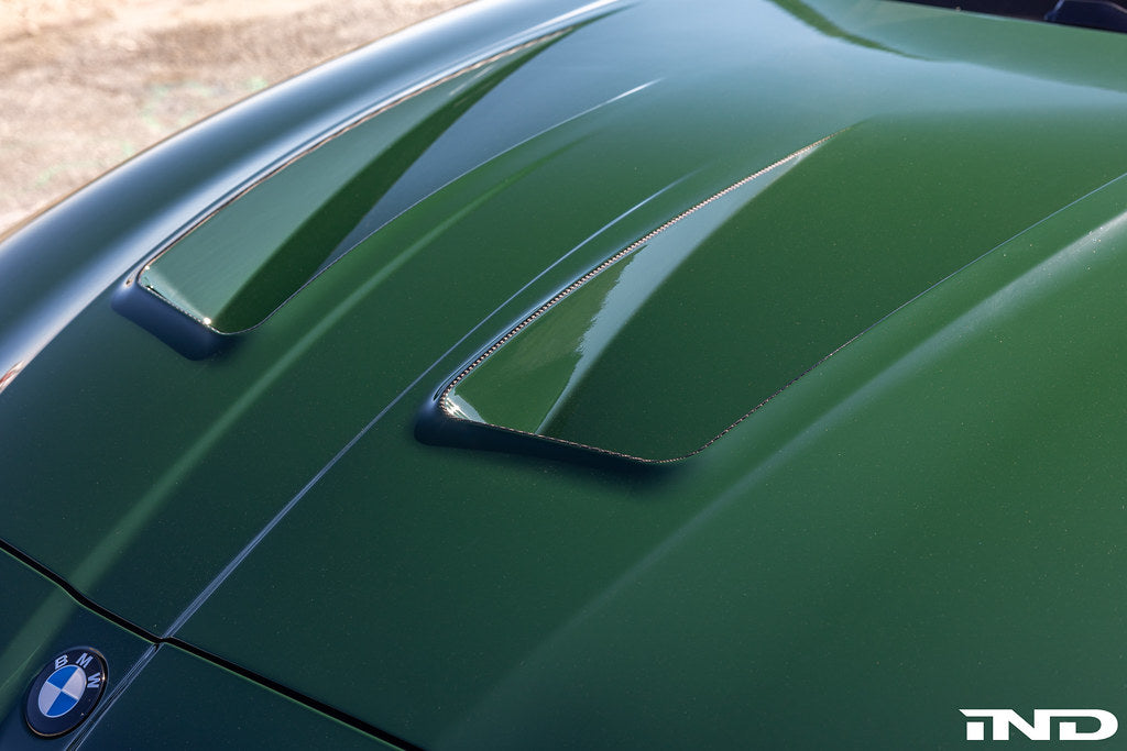 Alpha N Alpha-N G8X M3 M4 carbon vented hood installed on a vehicle, showcasing lightweight exterior upgrade for improved performance.