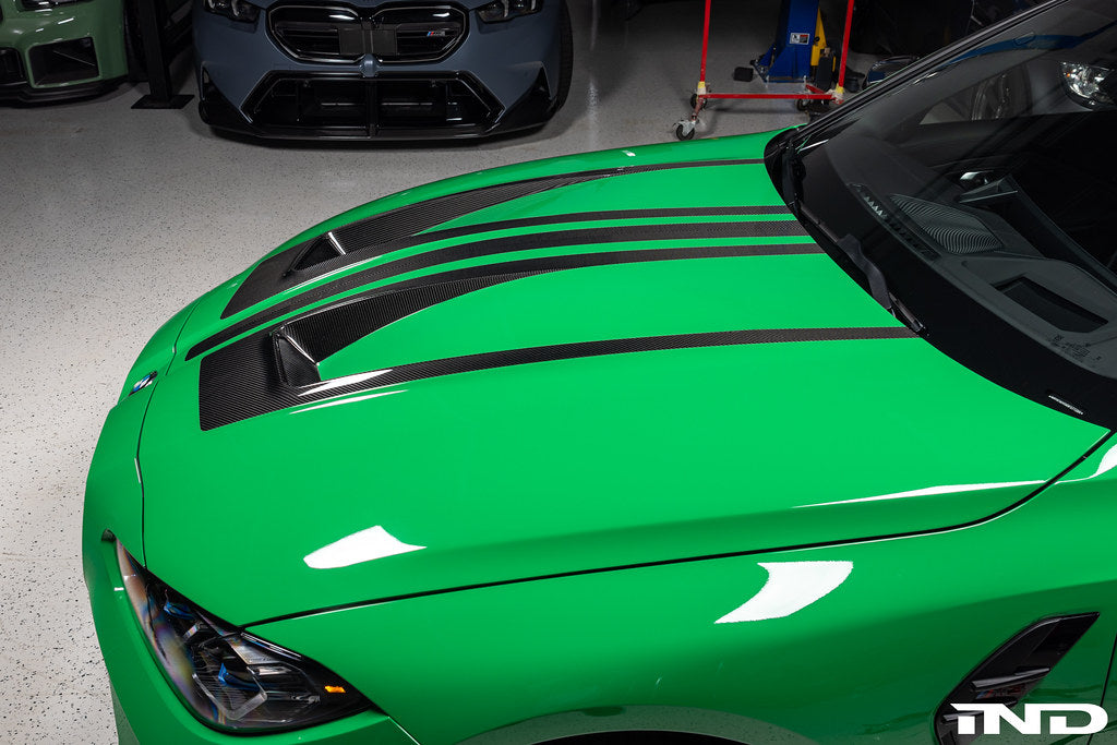 Alpha N G8X M3 M4 carbon vented hood, exterior view showing lightweight, aerodynamic design and venting features.