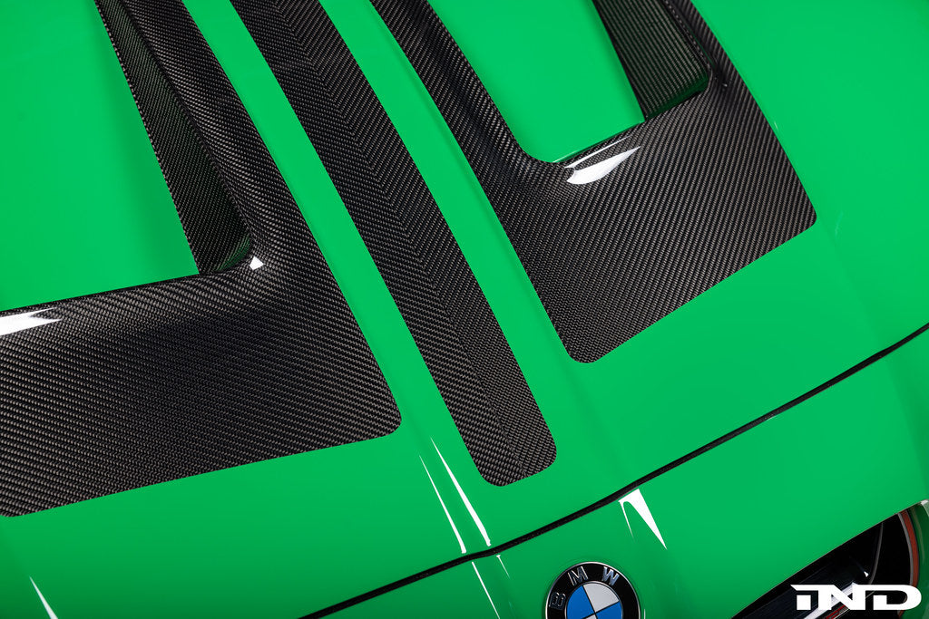 Alpha-N G8X M3/M4 carbon vented hood exterior shot showing lightweight, aerodynamic design and venting details.