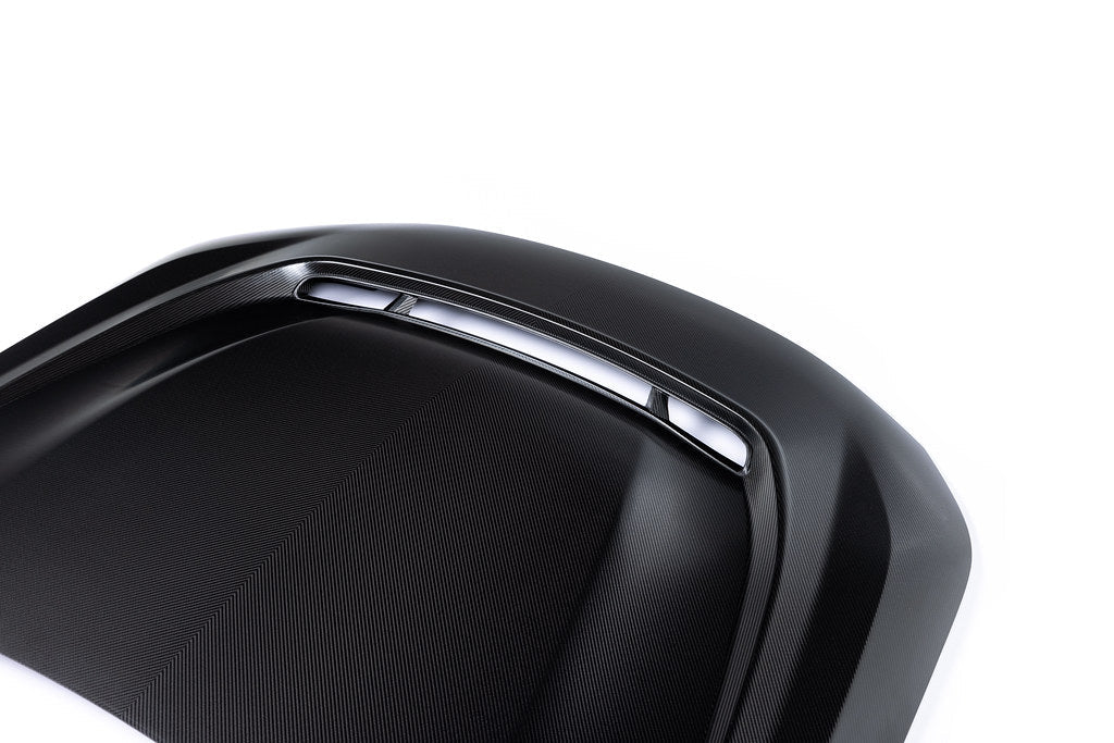 Alpha-N G87 M2 carbon vented hood with front vent insert on white background, showcasing its sleek exterior design.