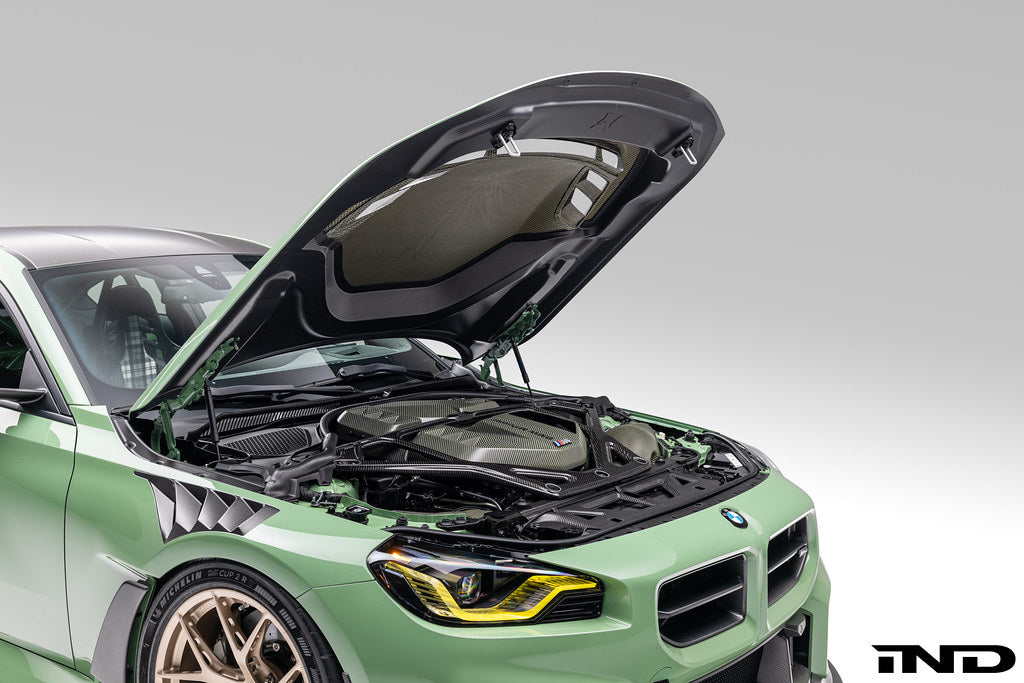 Alpha-N G87 M2 Carbon Vented Hood installed on a BMW M2 Clubsport, showing lightweight, vented exterior design for improved airflow.