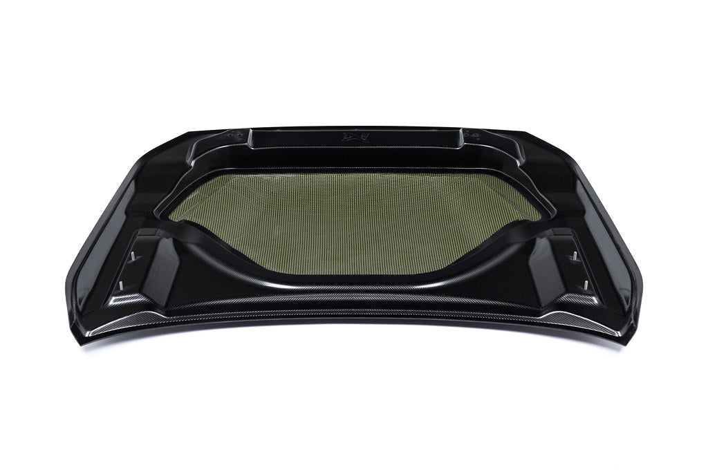 White Alpha N G87 M2 carbon vented hood shown on a white background, highlighting its lightweight, vented exterior design.
