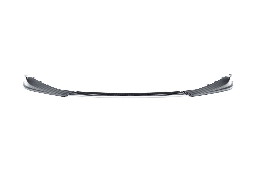Alpha N G8X M3 M4 carbon front spoiler mounted on white background, showcasing the exterior car enhancement.