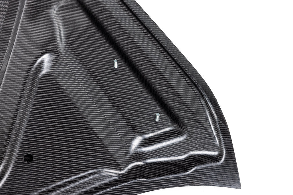 Alpha N G8X M3 M4 carbon fiber vented hood with raw finish, showcasing its lightweight, aerodynamic exterior design.