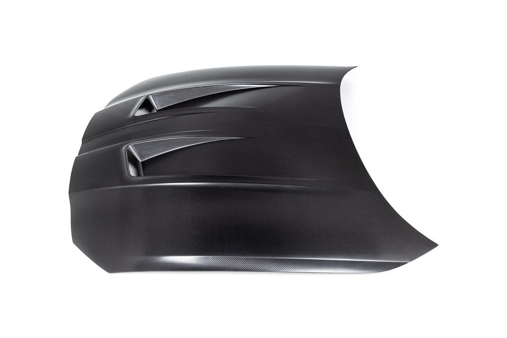Alpha N G8X M3 M4 carbon fiber vented hood with raw finish, showing detailed venting and sleek exterior design.