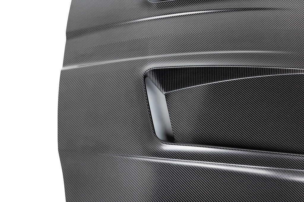 Alpha N G8X M3 M4 carbon fiber vented hood with raw finish, showcasing its lightweight, aerodynamic exterior design.