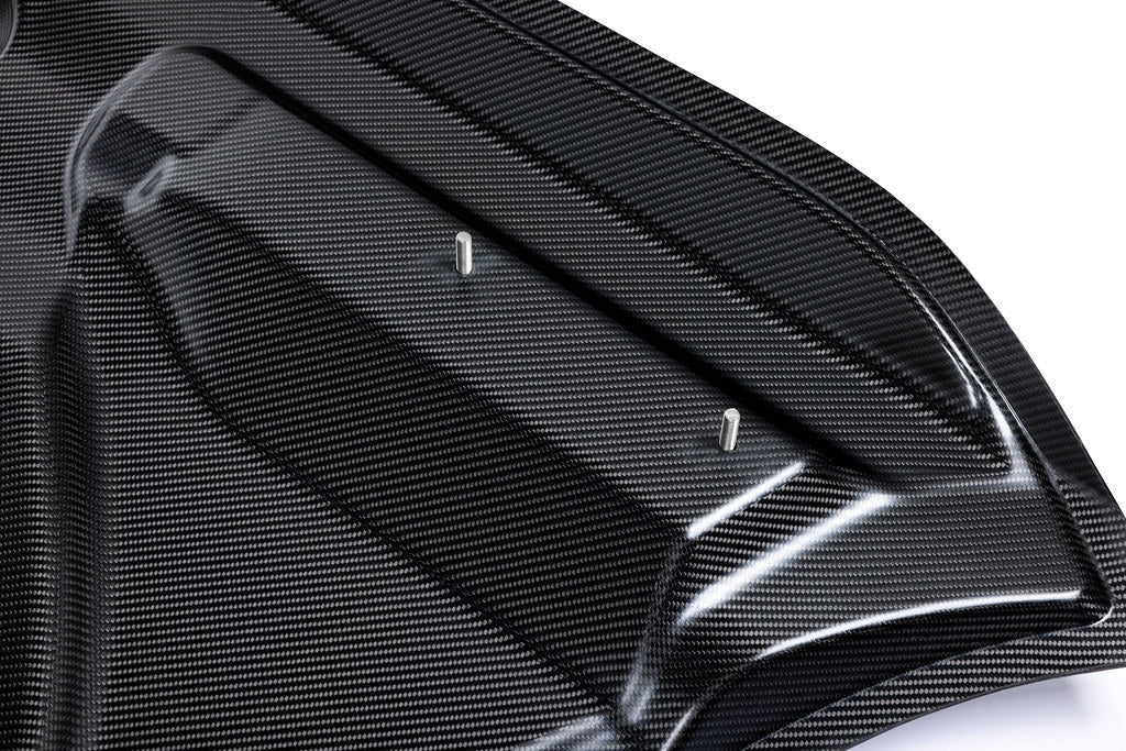 Alpha-N G87 M2 Carbon vented hood for exterior, shown in white background, highlighting lightweight carbon design and venting features.