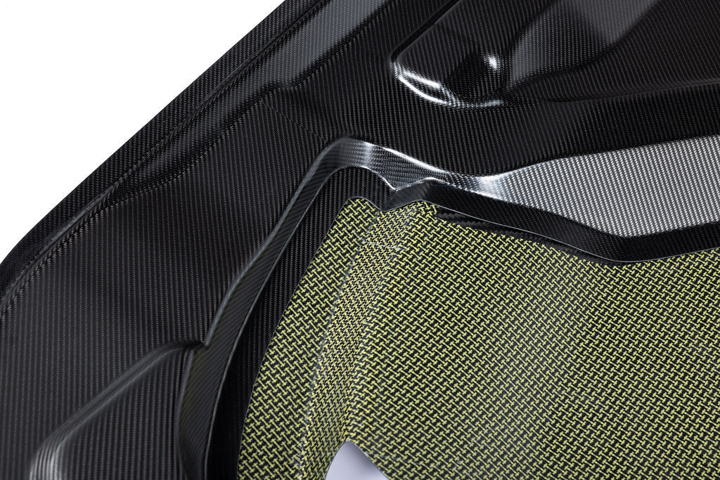 Alpha N G87 M2 carbon vented hood installed on a car, showcasing lightweight, aerodynamic exterior design with white background.