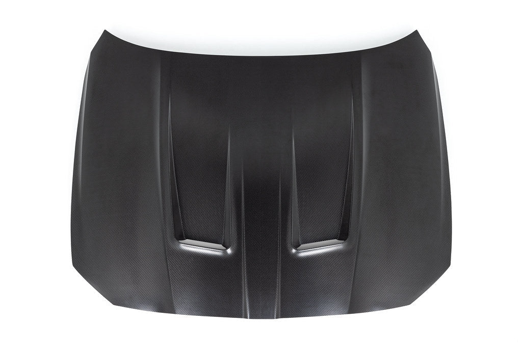 Alpha N G8X M3 M4 carbon fiber vented hood with raw finish, exterior view showing lightweight, aerodynamic design.