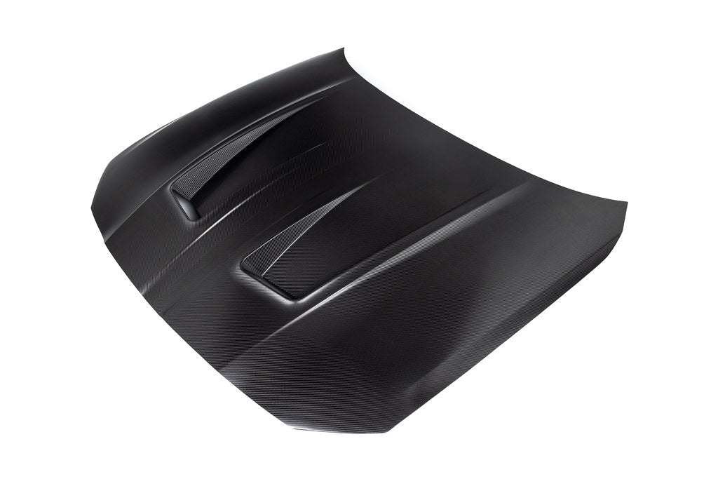 Alpha N G8X M3 M4 carbon fiber vented hood with raw finish, exterior view showcasing its lightweight, aerodynamic design.